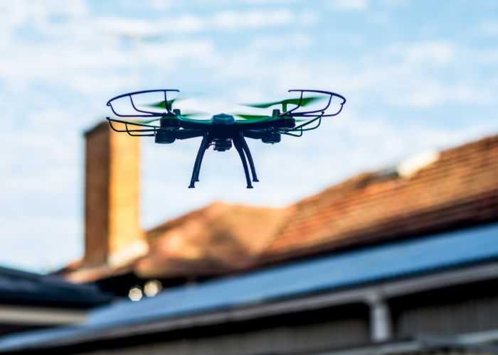 drone doing roof inspection in rhode island